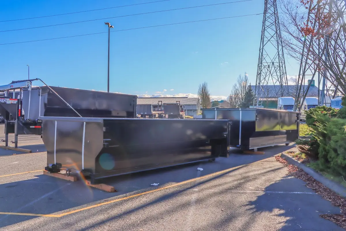 Roll-off dumpster ready for waste disposal at job site for Concrete Dumpster Rental in Guilford